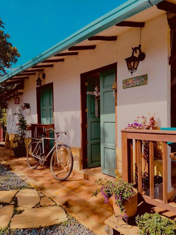 a bike parked in front of a house at Villa Paula in Barichara