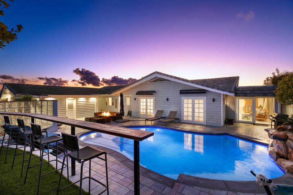 a swimming pool in the backyard of a house at Stunning View Estate with Pool & Game Room in La Mesa