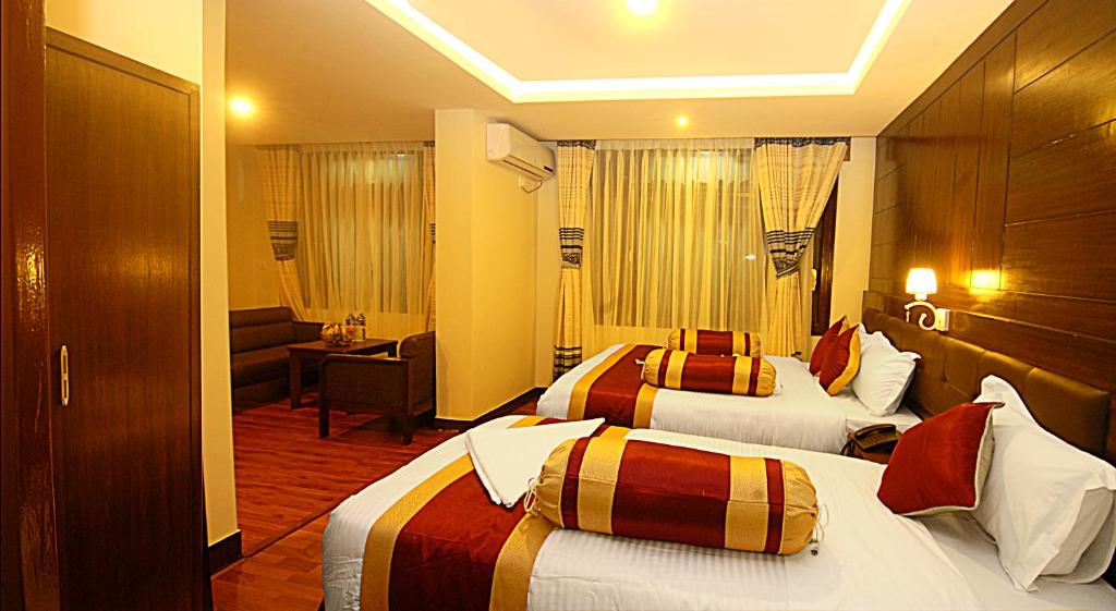 Postel nebo postele na pokoji v ubytování Hotel Buddha