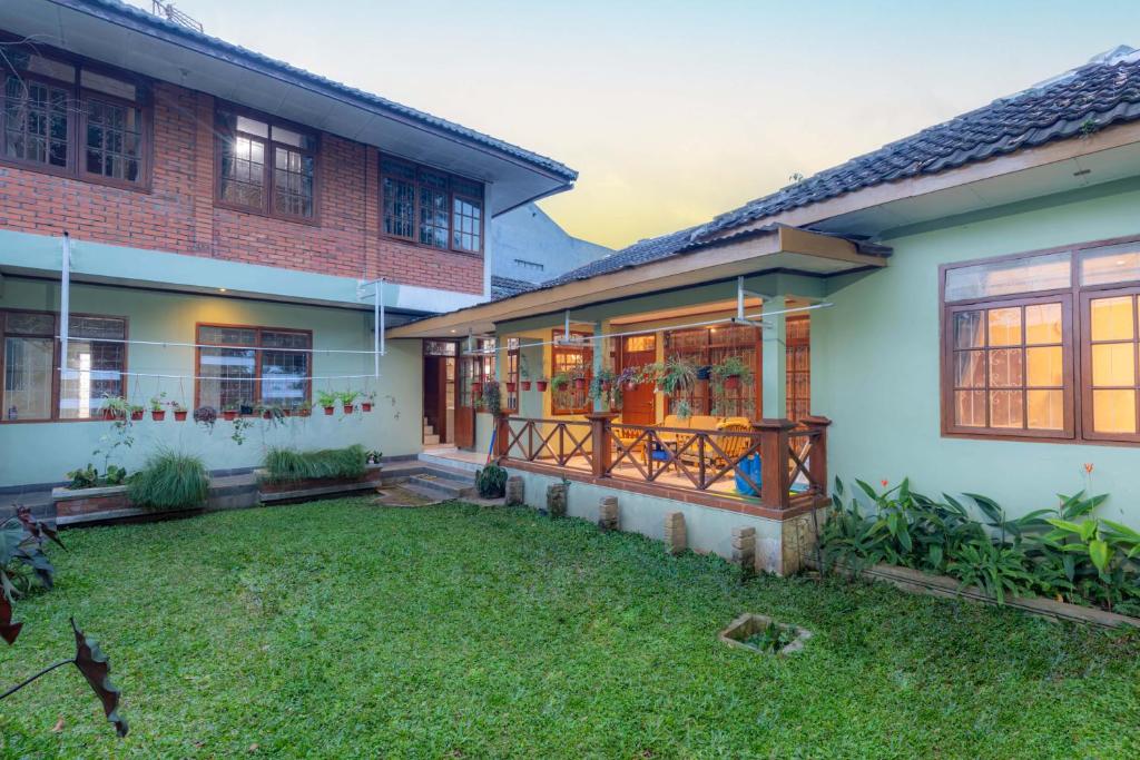 a house with a yard in front of it at Imah Budi Luhur in Bandung