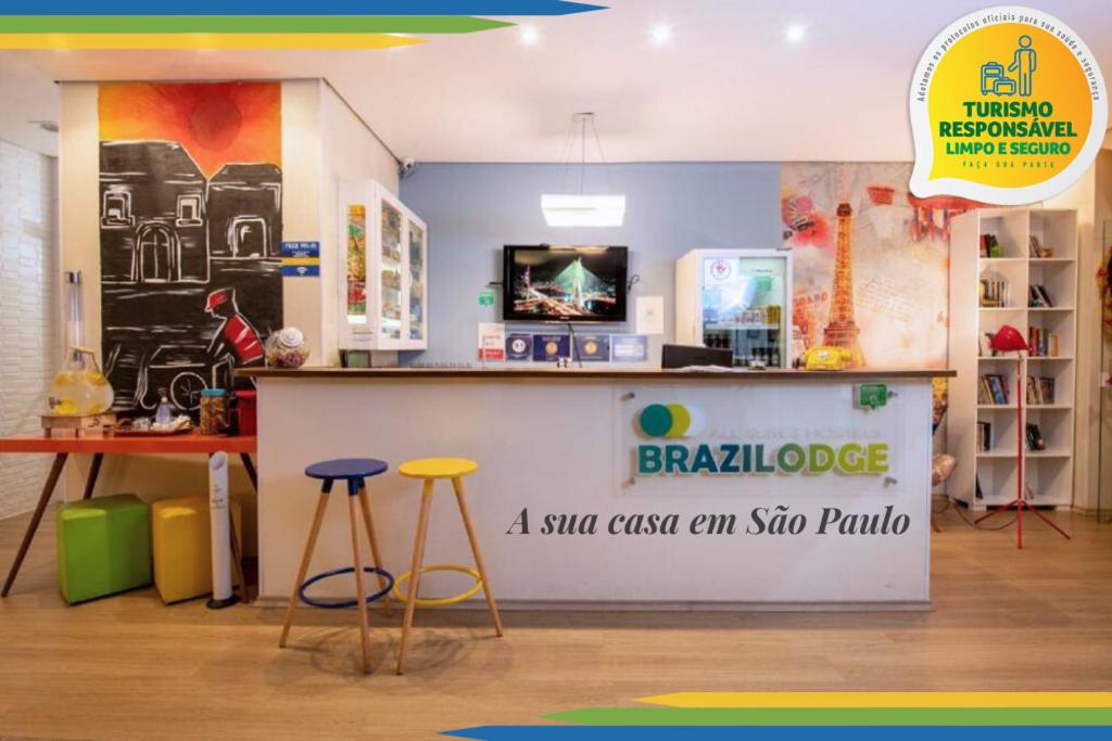 a shop with stools and a counter in a store at Brazilodge All Suites Hostel in São Paulo