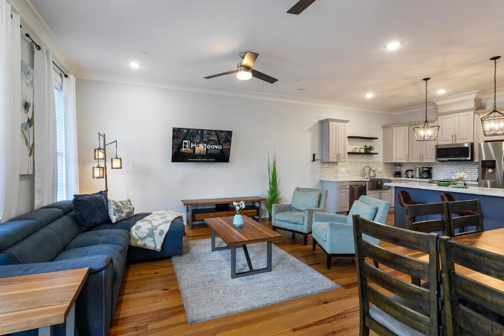 a living room with a couch and a table at Stunning 4BR-5BR near French Quarter Homes by Hosteeva in New Orleans