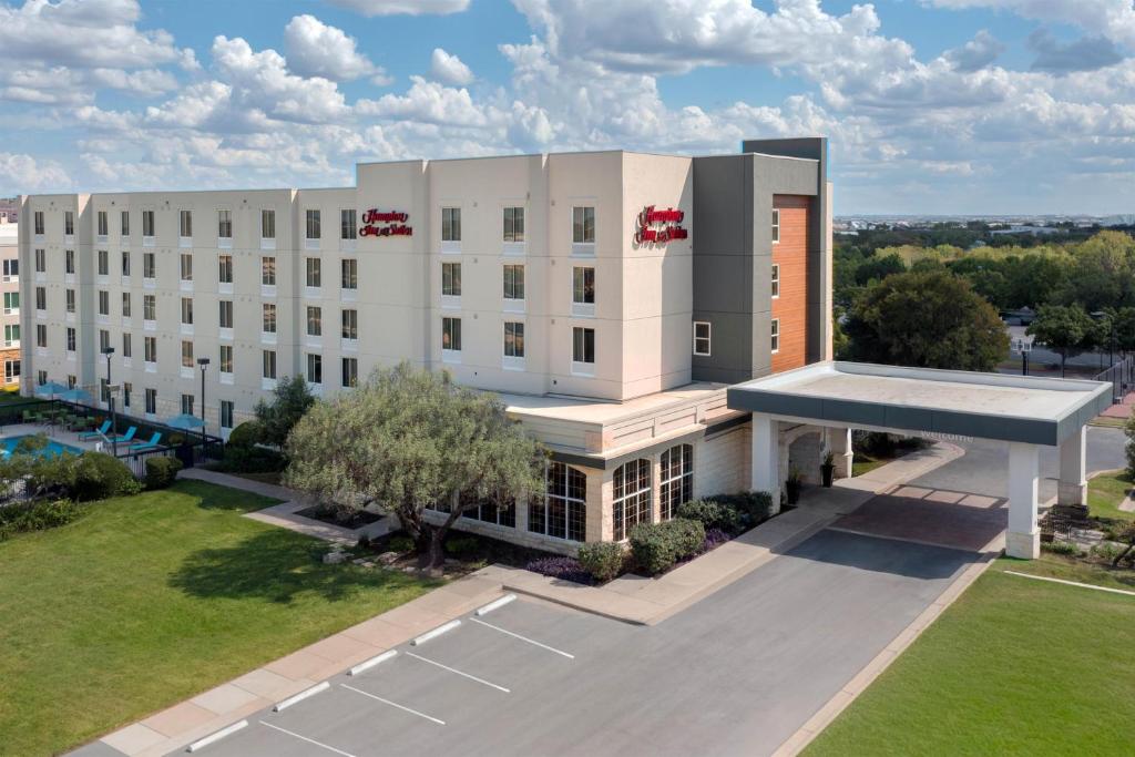 an overhead view of a large white building at Hampton Inn & Suites-Austin Airport in Austin