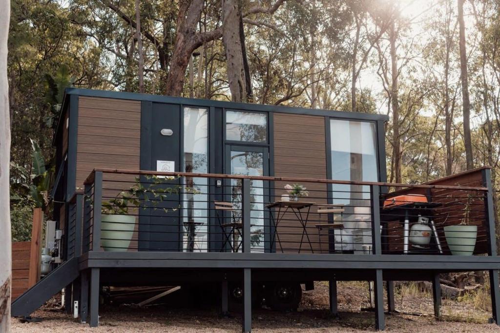 a tiny house is sitting on a trailer at Tiny Tamborine 2 by Tiny Away in Wongawallan