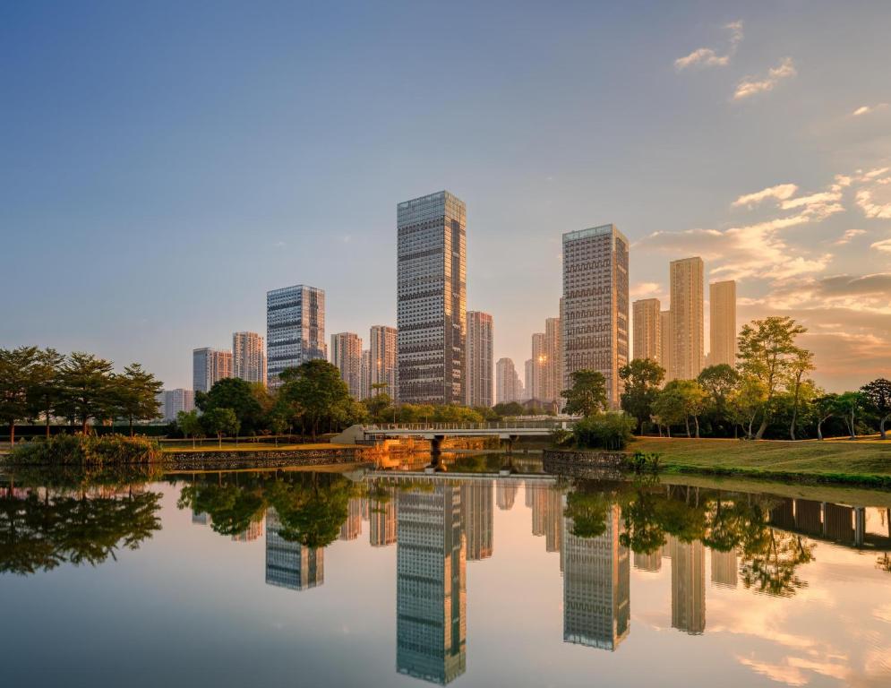 a view of a city skyline with a river and buildings at DoubleTree by Hilton Zhangzhou in Zhangzhou