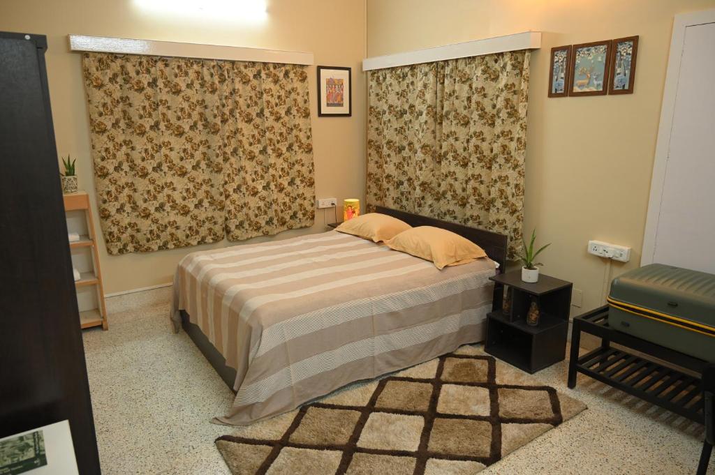a bedroom with a bed and a piano in it at Studio 61 Saltlake Sector 1 Kolkata in kolkata