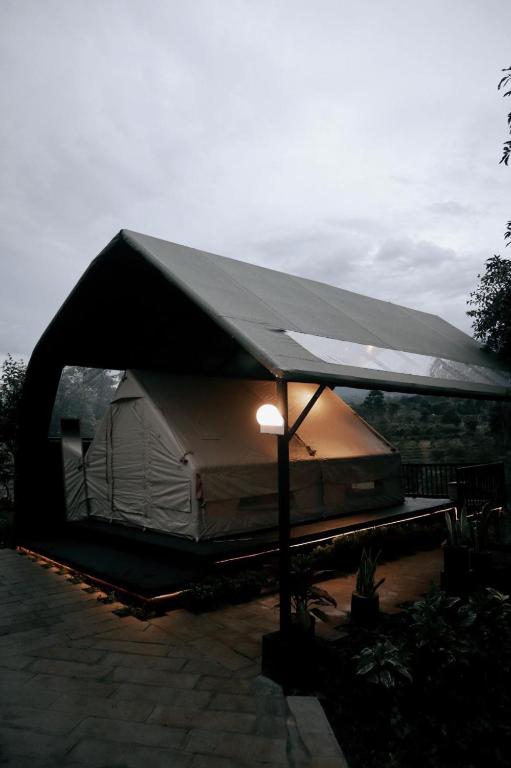 a large tent with a light under it at Arjuno Chatten Valley in Punten