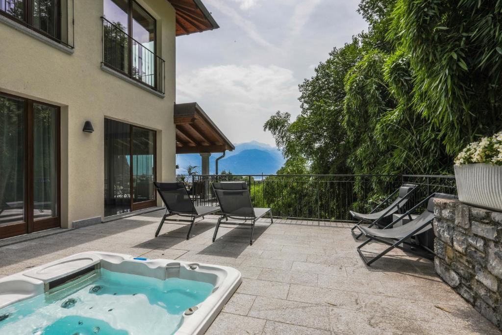 a hot tub on the patio of a house at Villa Elena in Menaggio