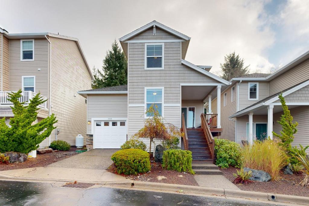 a house with a driveway in front of it at Sundown Lagoon in Tillamook
