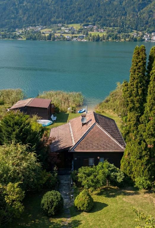 an aerial view of a house next to a lake at Seehaus Ossiachersee in Ossiach