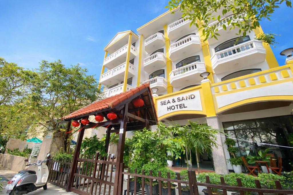 a building with a sign that reads last stand hotel at Sea and Sand Hotel in Hoi An