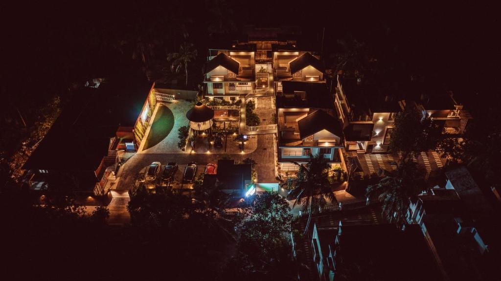 an aerial view of a building at night at Feliz Homes Kottakkal in Kottakkal