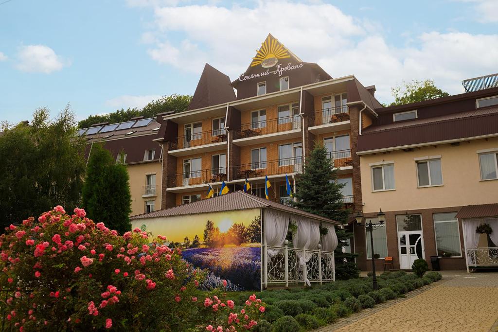 a building with a painting on the side of it at VitaPark Sonyachnyy Provans in Satanov
