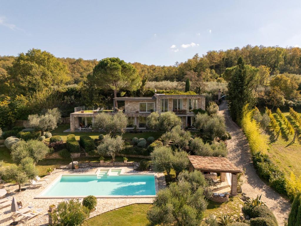 an aerial view of a house with a swimming pool in a garden at BRIGHTLINE VILLA 8, Emma Villas in Todi