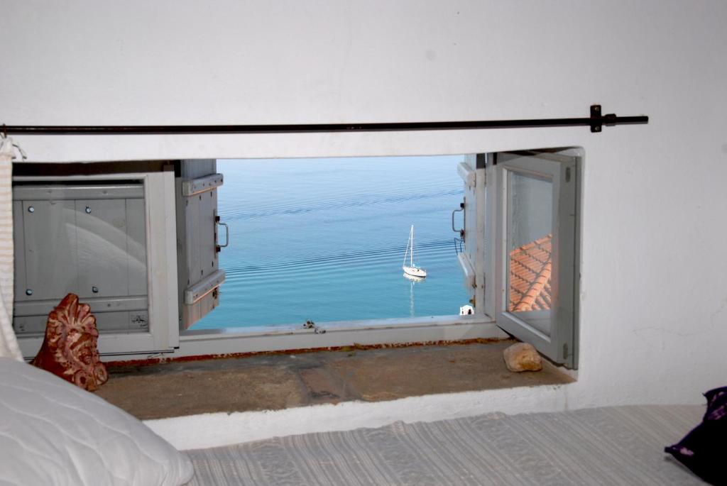 an open window with a view of the ocean at Heavens Nest in Mythimna