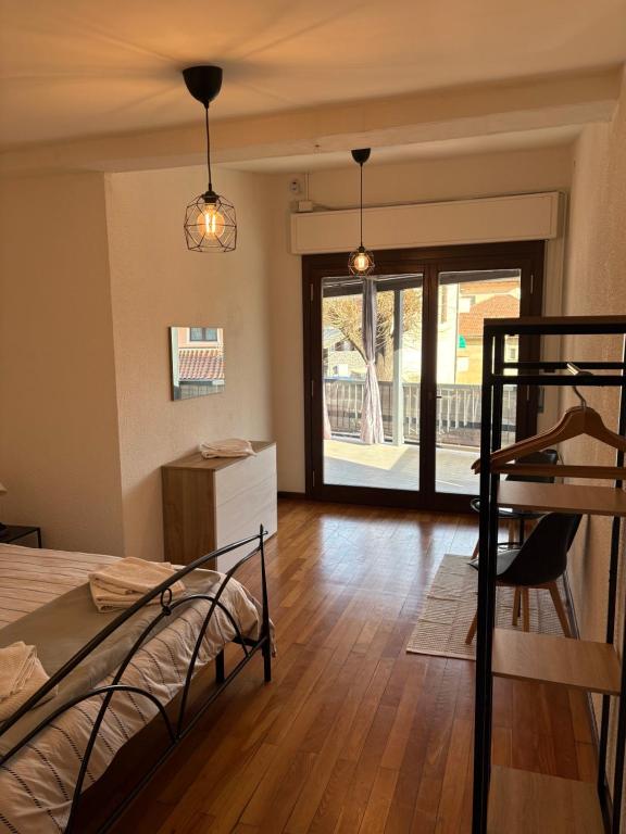 a bedroom with a bunk bed and a wooden floor at Ca baracot in Lanzo Torinese