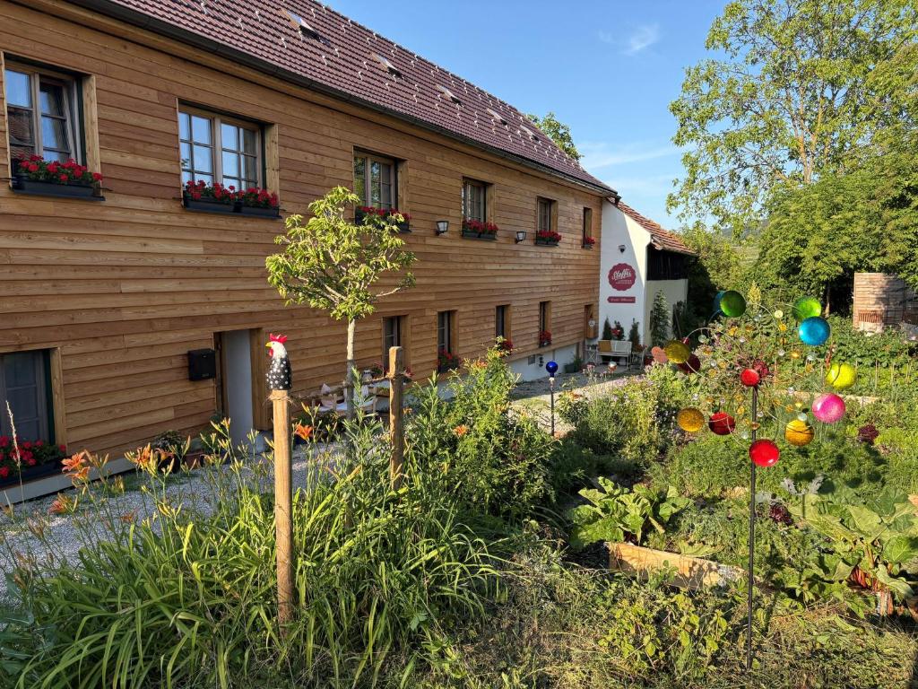 a garden in front of a building with easter eggs at Naturgartenurlaub in Steffis Ferienwohnungen in Tiefenfucha