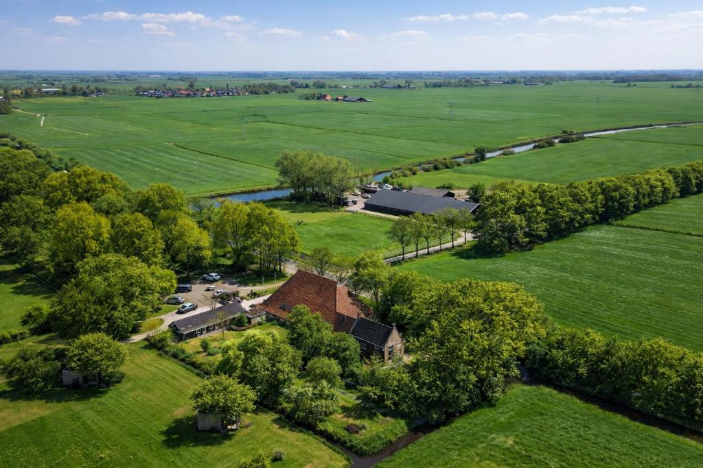 an aerial view of a house in a field at Pean-buiten Weidum in Weidum