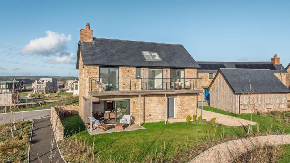 a large brick house on the side of a road at Stonehaven in Warmwell