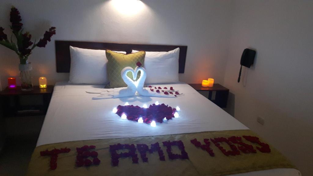 Postel nebo postele na pokoji v ubytování Veranda Hotel