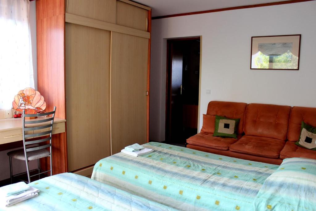 Łóżko lub łóżka w pokoju w obiekcie Apartments Cavae Romanae