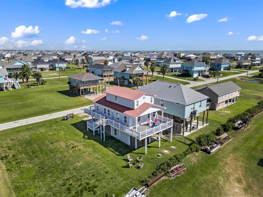 an aerial view of a home in a residential neighborhood at Once Upon A Tide in Bolivar Peninsula
