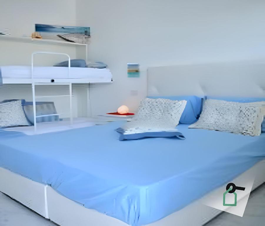 a room with a bed with blue lights on it at Hotiday Room Collection - Torre Lapillo in Torre Lapillo