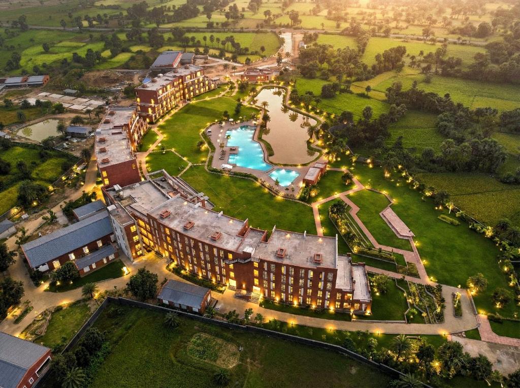 an aerial view of a resort with a pool and a park at Hotel Sonar Bangla Susunia in Kālipahāri
