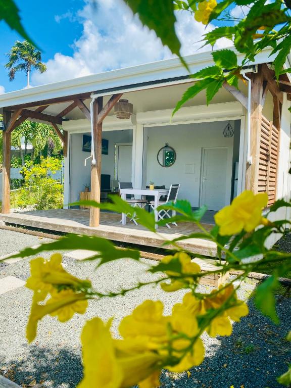 a view of a house with a patio at Vanille, à proximité des plages, idéalement situé pour visiter la Guadeloupe in Le Gosier
