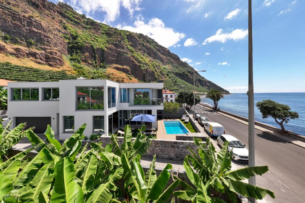 a villa with a view of the ocean at OurMadeira - BeachFront in Madalena do Mar