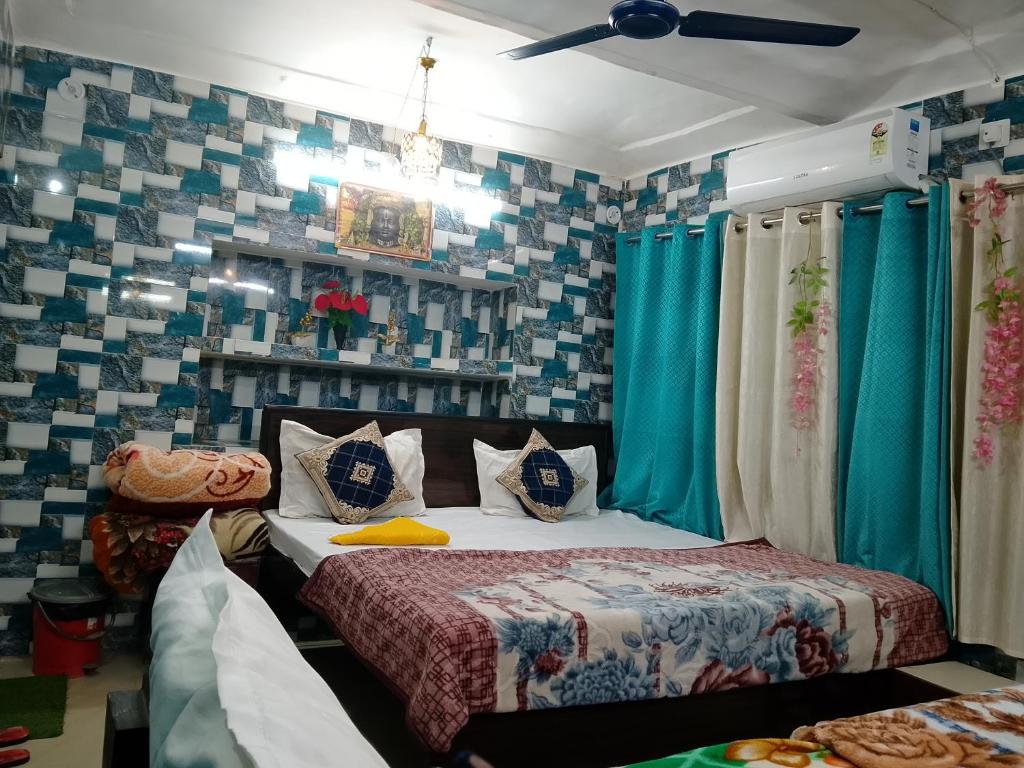 a bedroom with a bed and blue and white tiles at Luv Kush Homestay Ayodhya call now- 75659-24844 in Ayodhya