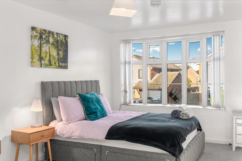 a bedroom with a bed and a window at Badger Haven, Apartment 2 in Brackley