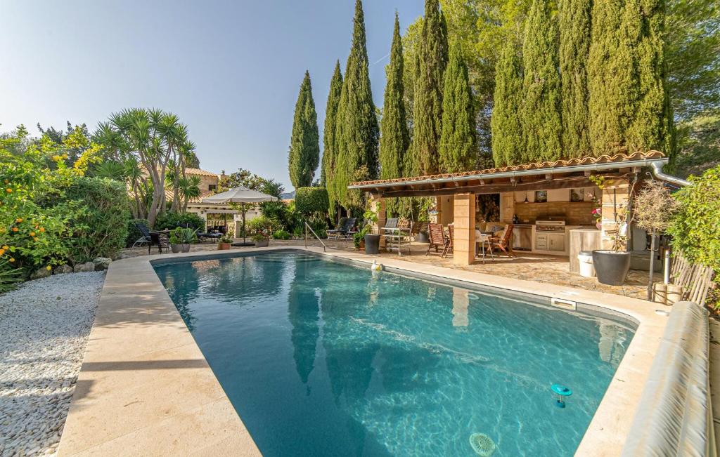 a swimming pool in the backyard of a house at Can Taco in Galilea