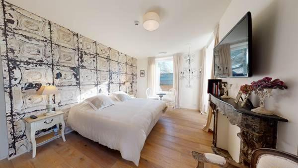 Llit o llits en una habitació de B&B Les Tilleuls