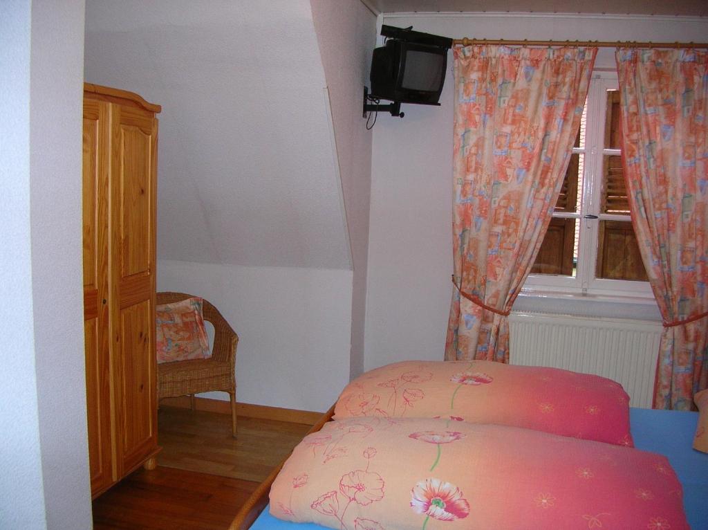 Postel nebo postele na pokoji v ubytování Hotel-Restaurant du Windstein