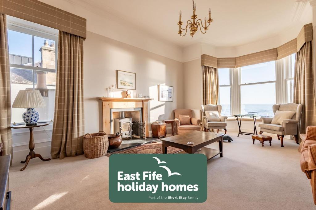 an image of a living room with a fireplace at Upper Rocklands - Elie in Earlsferry
