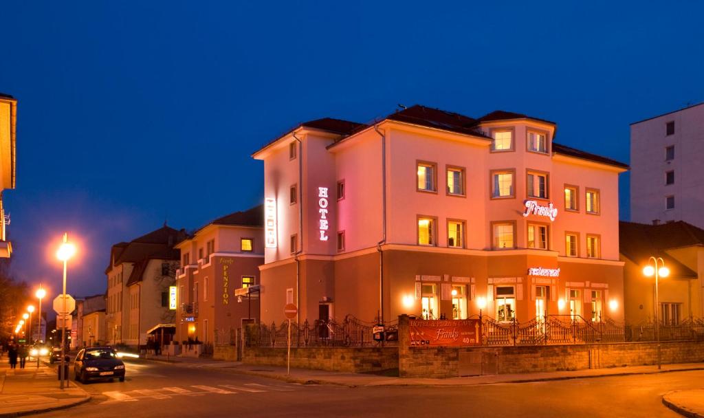 a building on the side of a street at night at Franko hotel in Zvolen
