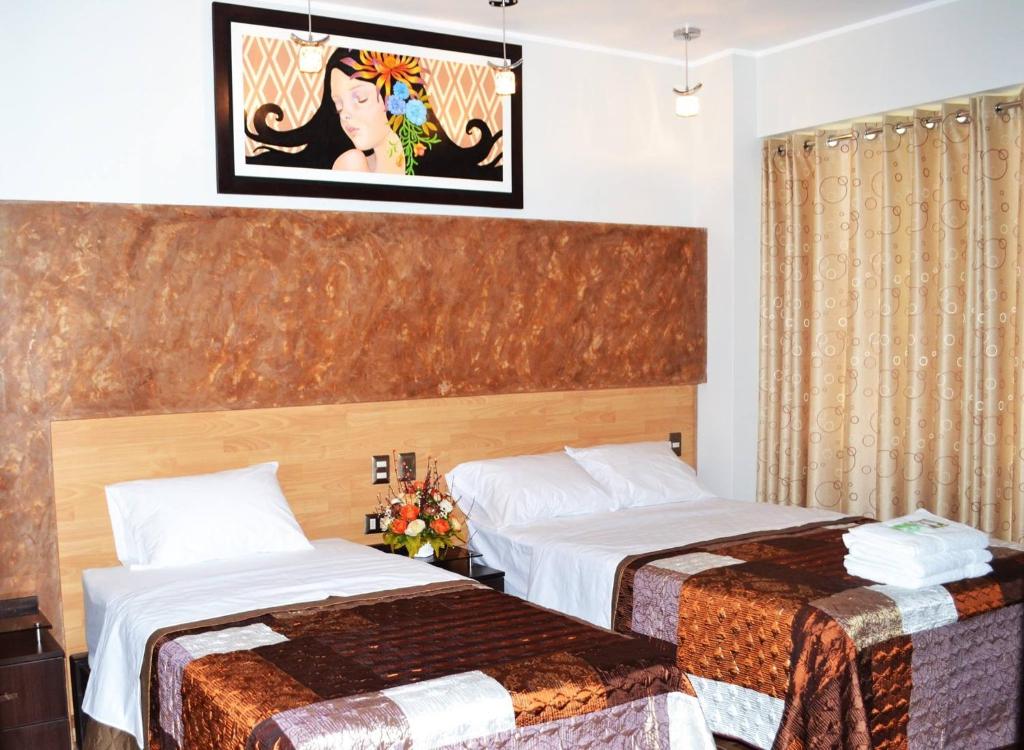 Postel nebo postele na pokoji v ubytování Hostal Gold Star