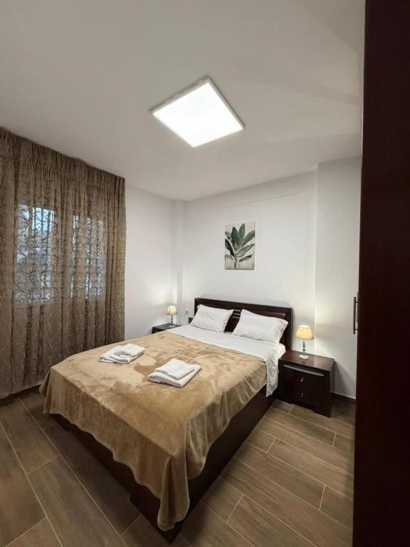 a bedroom with a bed with two towels on it at Le Grace, Urban Retreat near Near CityCenter & Sea in Thessaloniki