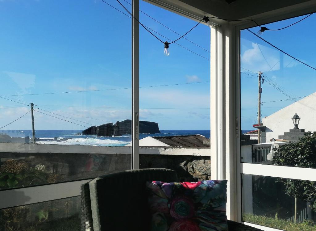 a view of the ocean from a room with a window at Mosteiros Coastal Haven in Mosteiros