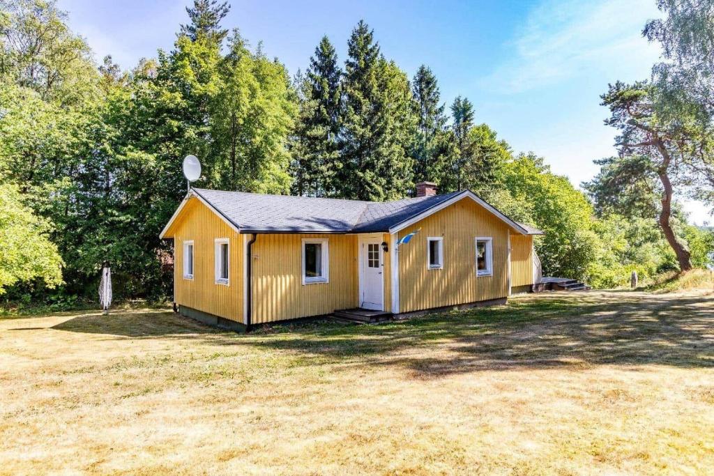 a tiny house in a field with trees at HAL819-Unnaryd-Soedra-vaegen-29-b in Unnaryd