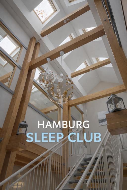 a chandelier hangs from the ceiling of a house at Hamburg Sleep Club in Hamburg