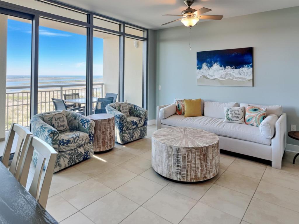 a living room with a couch and chairs and a table at Palisade Palms TW1012 - Sea Escape in Galveston