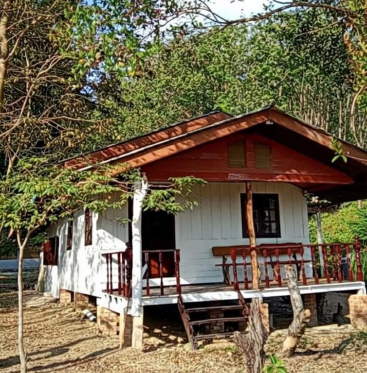 a small white house with a red roof at Ploy Chumpoo Kantiang in Ko Lanta
