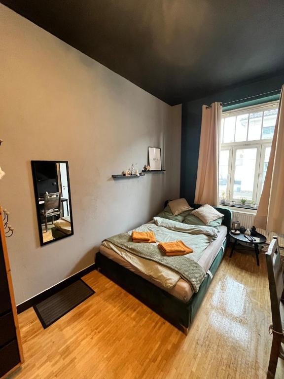a bedroom with a bed and a large window at Design Apartment in Plettenberg