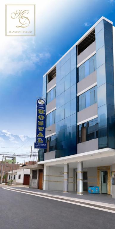 a building with a sign on the side of it at Gran Mansion Dorada in Tacna