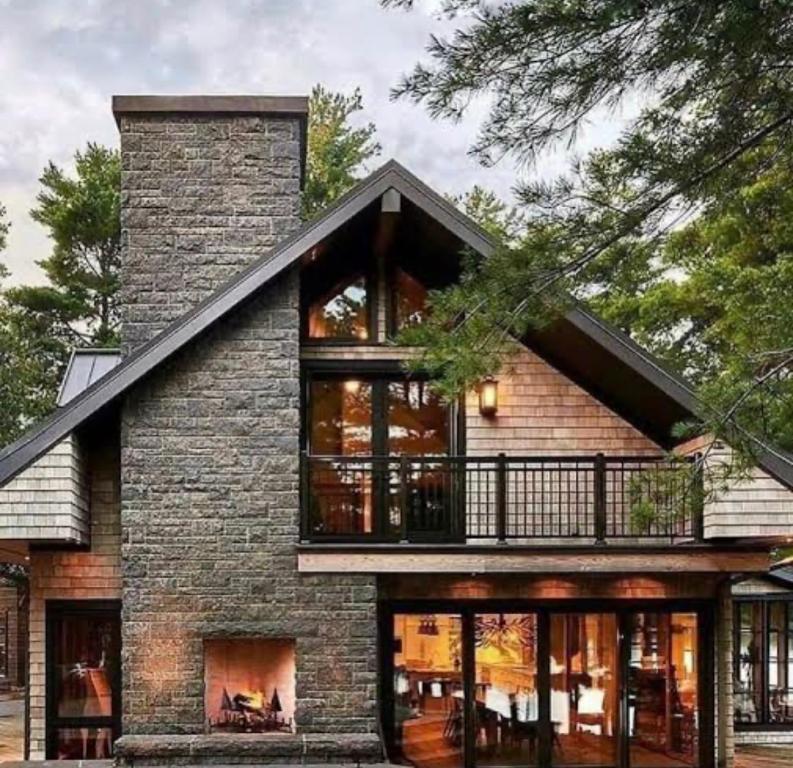 a brick house with a balcony on top of it at The Haven Retreat in Roodepoort