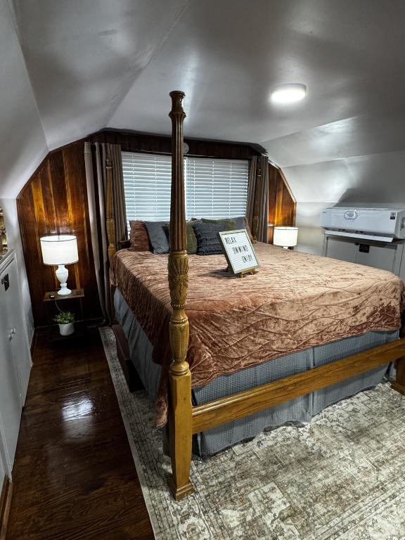 a bedroom with a bed with a sign on it at Meadowview Guest House in Hillsboro