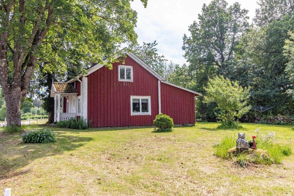 a red and white barn with a yard at KRO863-Virestad-Stubbalycke-4 in Virestad