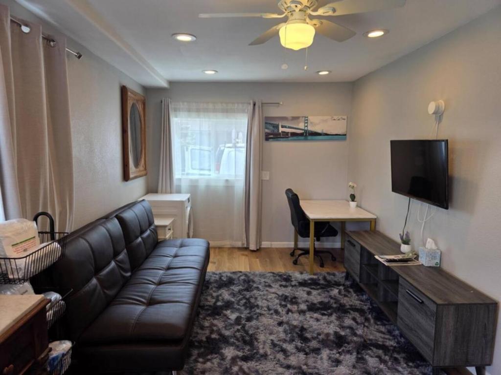 a living room with a couch and a table at Modern Victorian by Beach and Forest Unit B in Crescent City